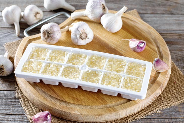 Freeze garlic in ice cube trays
