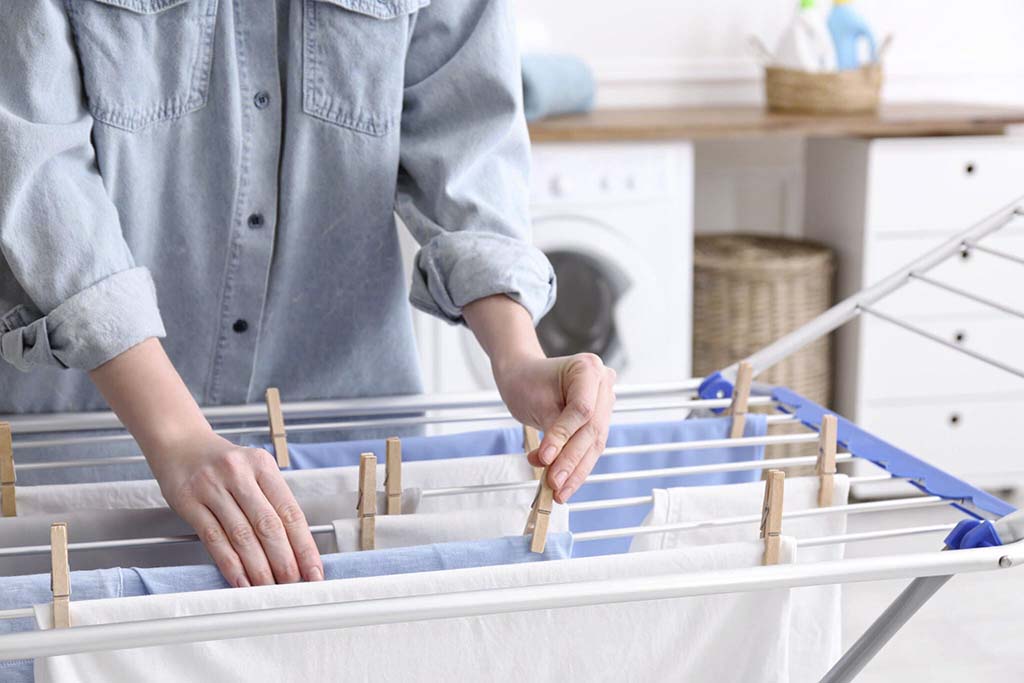 Arrange the laundry on a drying rack