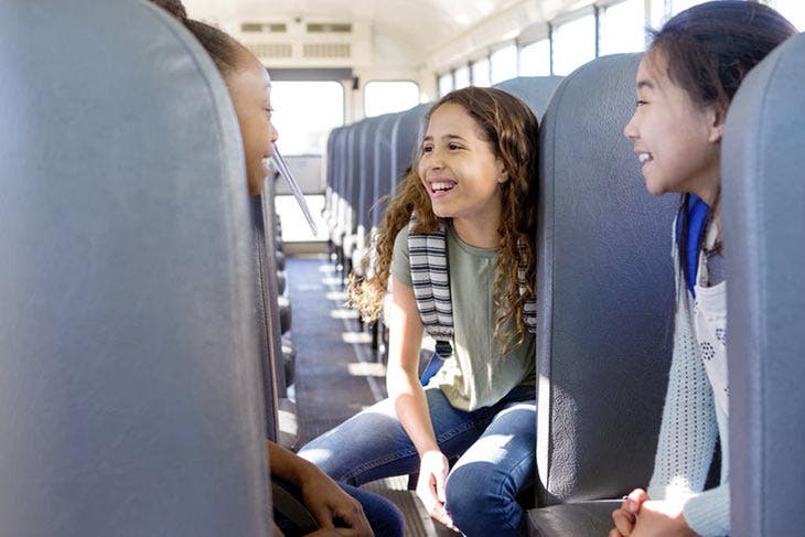 Children chatting on the school bus