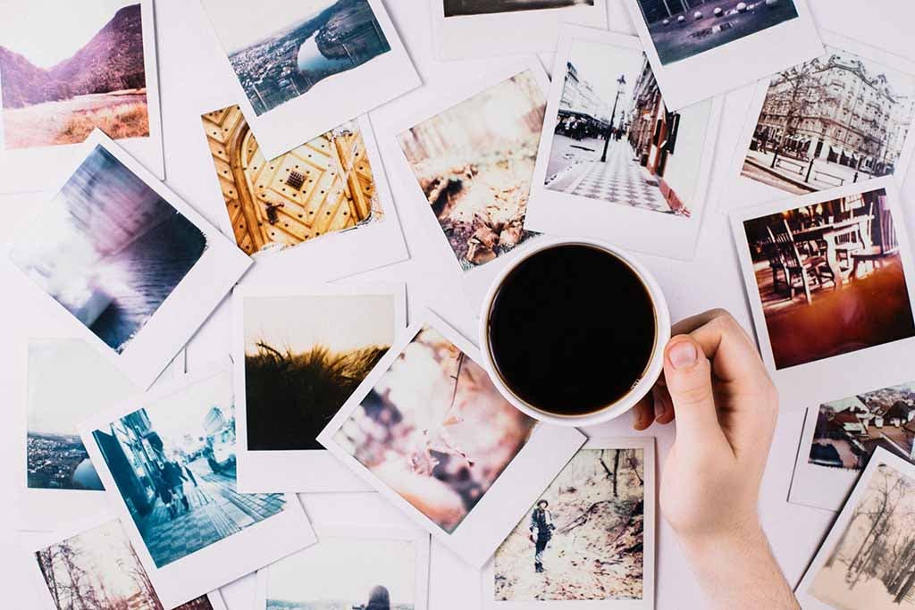 Set of photos and a cup of coffee