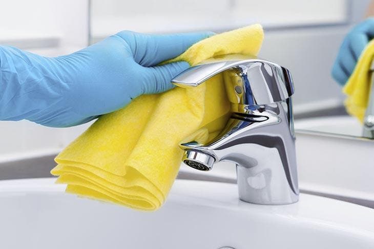 Clean the faucet with a cloth