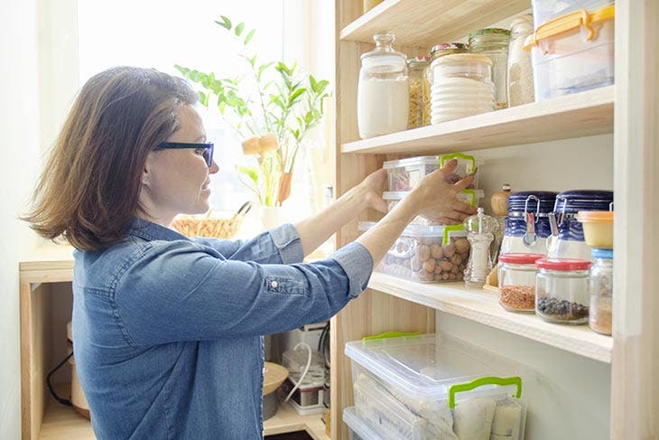 woman arranging her shelf