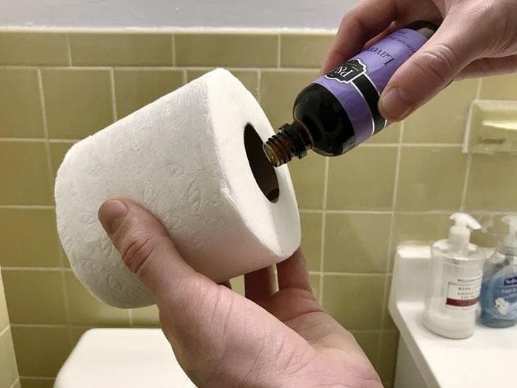 Essential oil poured on a toilet paper roll
