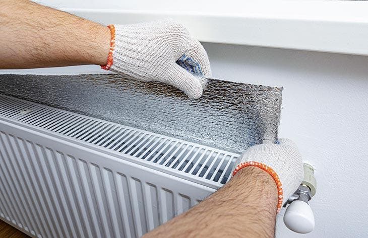 Installation of an insulating film behind the radiator.