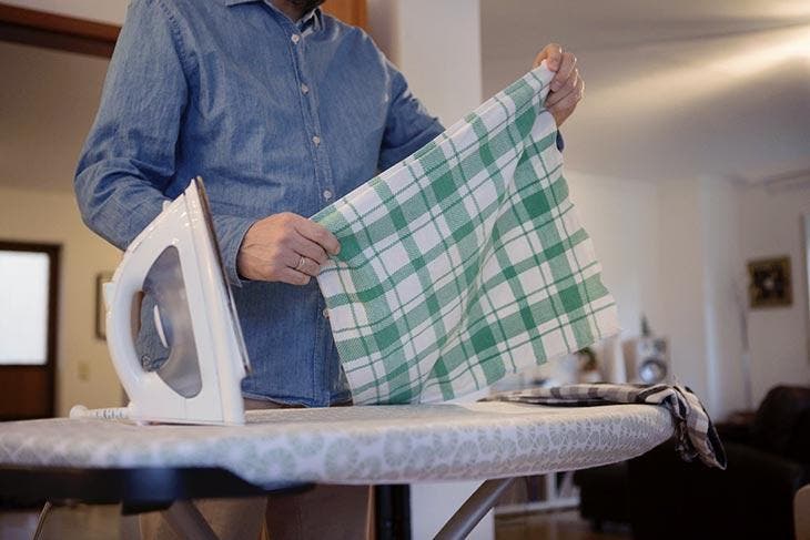 Ironing kitchen towels absorb moisture and musty smells.