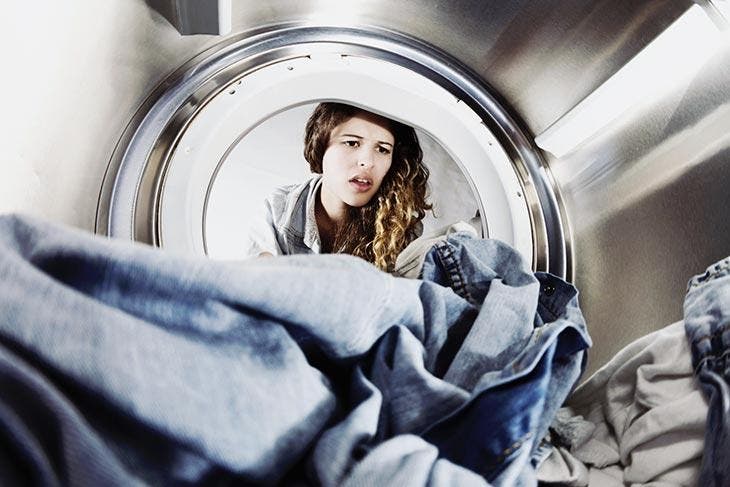 Dirty clothes in the drum of the washing machine