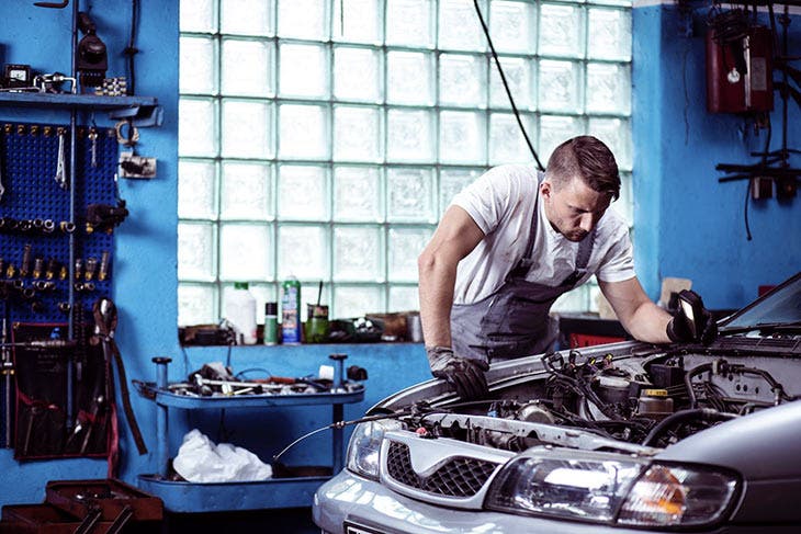 Mechanic working on a car