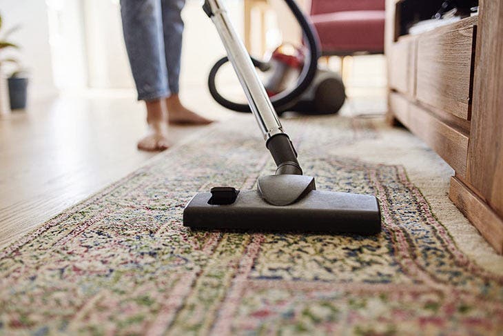 Clean the carpet with a vacuum cleaner