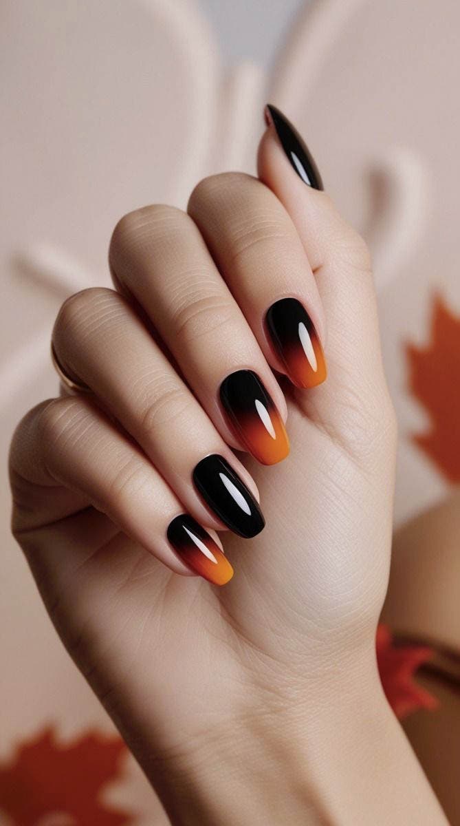 Ongles dégradés aux tons noir et orange Ongles dégradés aux tons noir et orange