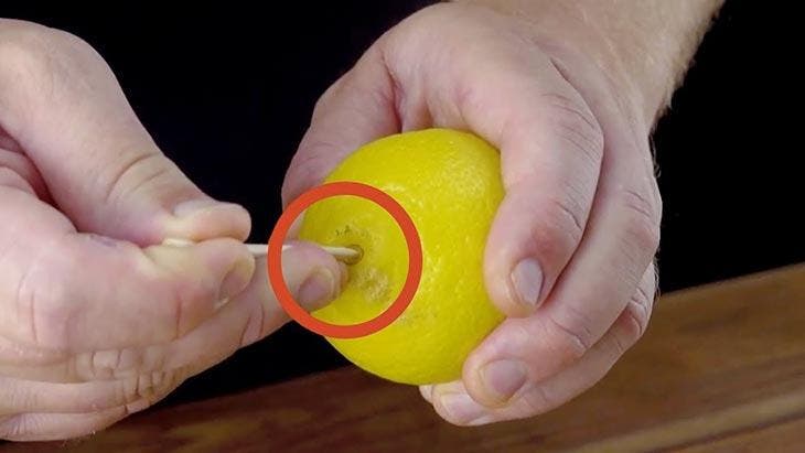 Pierce a lemon with a toothpick