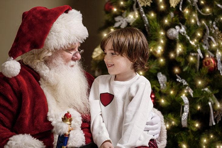 Child happy to meet Santa Claus