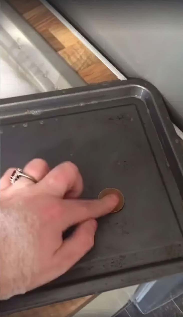 Place a coin on a baking sheet