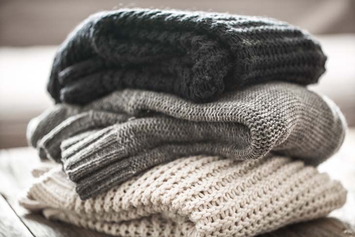 folded wool sweaters
