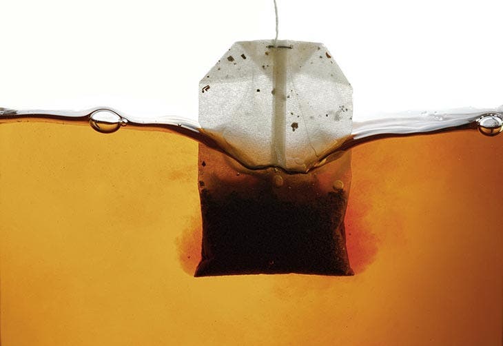 Black tea bag soaked in hot water
