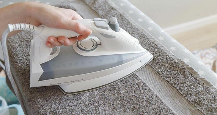Dry the clothes with the iron