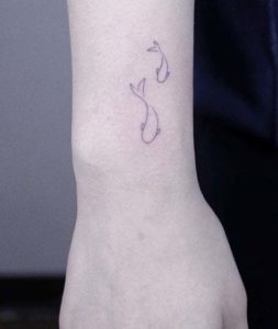 Tatouage Poisson Minimaliste