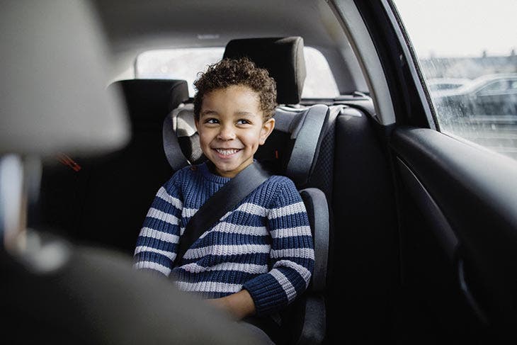 a boy sitting in the car