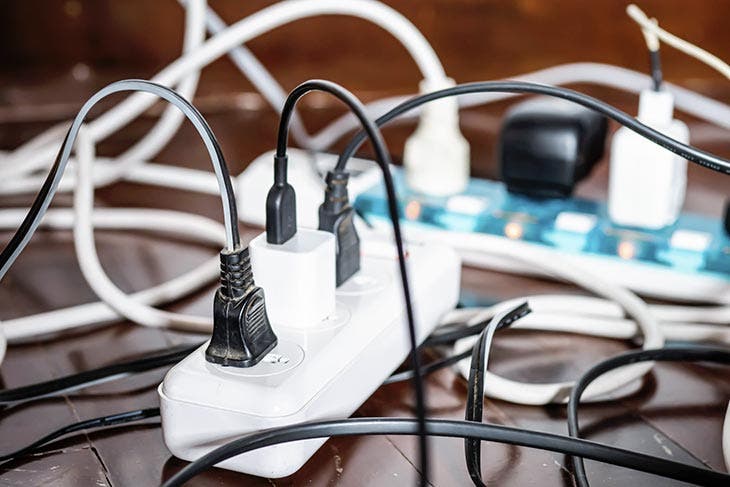 A power strip with wires plugged in