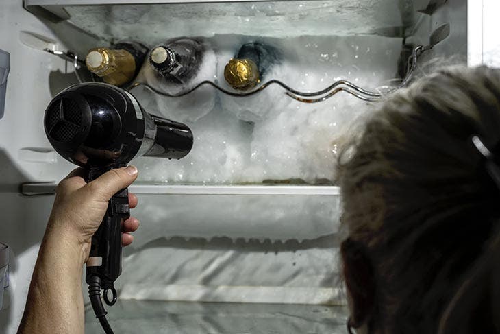 Use a hair dryer to melt ice from the refrigerator