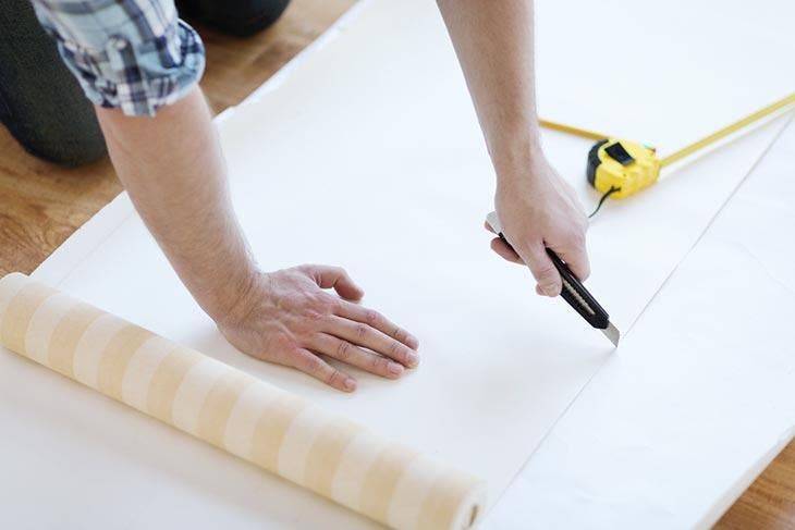 Use a wallpapering knife